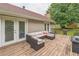 Back deck with an outdoor couch and table, perfect for entertaining or relaxing outside at 3333 Old Salem Se Rd, Conyers, GA 30013
