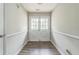 Bright entryway featuring wood-look floors, white trim and a glass paneled front door at 3333 Old Salem Se Rd, Conyers, GA 30013