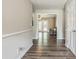 Hallway with wood floors leading to the living room and featuring neutral paint at 3333 Old Salem Se Rd, Conyers, GA 30013