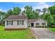 Charming single-story home featuring gray siding, black shutters, and a well-manicured lawn at 3333 Old Salem Se Rd, Conyers, GA 30013