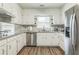 Well-equipped kitchen features modern stainless-steel appliances, granite countertops, and functional design for culinary enthusiasts at 3333 Old Salem Se Rd, Conyers, GA 30013