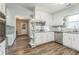 Bright kitchen features stainless steel appliances, granite counters, white cabinets, and functional layout for culinary enthusiasts at 3333 Old Salem Se Rd, Conyers, GA 30013