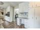 Spacious kitchen featuring white cabinetry, stainless appliances, and modern countertops, offering style and functionality at 3333 Old Salem Se Rd, Conyers, GA 30013