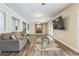 Cozy living room with brick fireplace, wood-look floors and ample natural light at 3333 Old Salem Se Rd, Conyers, GA 30013