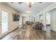 Spacious living room with wood floors and neutral walls with multiple seating areas at 3333 Old Salem Se Rd, Conyers, GA 30013