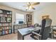 Bright office space with bookshelves, work space and large window letting in natural light at 3333 Old Salem Se Rd, Conyers, GA 30013
