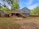 Spacious backyard featuring a deck, with a fenced in yard at 5080 Brownwood Dr, Powder Springs, GA 30127