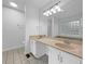 Bathroom with double sinks, a large mirror, and great lighting at 5080 Brownwood Dr, Powder Springs, GA 30127