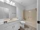 Bathroom features single vanity, toilet and tub at 5080 Brownwood Dr, Powder Springs, GA 30127