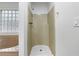 Tub/shower area with natural light from glass block window at 5080 Brownwood Dr, Powder Springs, GA 30127