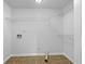 Walk in closet with wire shelving and laminate tile floors at 5080 Brownwood Dr, Powder Springs, GA 30127