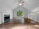 Open living room with hardwood floors, a fireplace, and lots of natural light at 5080 Brownwood Dr, Powder Springs, GA 30127