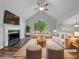 Bright living room featuring a fireplace, large windows, and vaulted ceilings at 5080 Brownwood Dr, Powder Springs, GA 30127