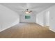 Open concept living room with ceiling fan and carpet at 5080 Brownwood Dr, Powder Springs, GA 30127