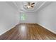 Large main bedroom with trey ceilings, laminate floors, and bright natural light at 5080 Brownwood Dr, Powder Springs, GA 30127