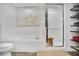 Clean and bright bathroom with a soaking tub, a separate shower, and modern fixtures at 845 Spring Nw St # 129, Atlanta, GA 30308