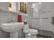 Modern bathroom with gray tiling, a sleek vanity, and glass-enclosed shower for a spa-like feel at 845 Spring Nw St # 129, Atlanta, GA 30308