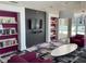 Inviting common area with bookshelves, a TV, and comfortable seating for residents at 845 Spring Nw St # 129, Atlanta, GA 30308