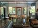 Bright dining area with large windows, a stylish table setting, and comfortable seating, ideal for gatherings at 845 Spring Nw St # 129, Atlanta, GA 30308