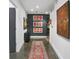 Inviting hallway decorated with elegant artwork and a stylish runner rug, creating a sophisticated ambiance at 845 Spring Nw St # 129, Atlanta, GA 30308