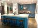 Modern kitchen features a large island with seating, sleek cabinets, and pendant lighting, perfect for dining at 845 Spring Nw St # 129, Atlanta, GA 30308