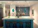 Modern kitchen featuring a large island with seating, sleek cabinets, and pendant lighting, perfect for entertaining at 845 Spring Nw St # 129, Atlanta, GA 30308