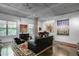 Spacious living room with exposed concrete ceilings, modern decor, and large windows offering ample natural light at 845 Spring Nw St # 129, Atlanta, GA 30308