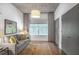 Cozy living room featuring a comfortable couch, patterned rug, and window providing natural light at 845 Spring Nw St # 129, Atlanta, GA 30308