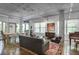 Bright living room with large windows, chic furnishings, and an open dining area at 845 Spring Nw St # 129, Atlanta, GA 30308