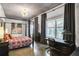 Comfortable main bedroom with ample natural light, a stylish canopy bed, and dedicated desk space at 845 Spring Nw St # 129, Atlanta, GA 30308