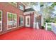 View of the backyard deck with steps leading down to the yard, perfect for entertaining at 1595 Lake Lucerne Rd Sw, Lilburn, GA 30047