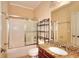Bathroom featuring shower-tub combination, toilet, and granite vanity at 1595 Lake Lucerne Rd Sw, Lilburn, GA 30047