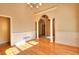 Elegant dining room featuring hardwood floors, wainscoting, and stylish architectural details at 1595 Lake Lucerne Rd Sw, Lilburn, GA 30047