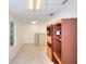 Well-lit hallway with convenient built-in shelving for storage and organization, great for any home office at 1595 Lake Lucerne Rd Sw, Lilburn, GA 30047