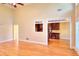 Open-concept living space with hardwood flooring and views of the adjacent kitchen area at 1595 Lake Lucerne Rd Sw, Lilburn, GA 30047