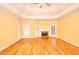 Spacious living room features hardwood floors, fireplace, multiple windows, and stylish ceiling at 1595 Lake Lucerne Rd Sw, Lilburn, GA 30047
