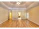 Large main bedroom boasts hardwood floors, tray ceiling and private ensuite bathroom at 1595 Lake Lucerne Rd Sw, Lilburn, GA 30047