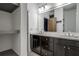 Bathroom vanity with dark wood cabinets, granite countertop and large mirror at 1802 Dekalb Ne Ave, Atlanta, GA 30307