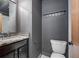 Modern bathroom with granite countertop, dark gray walls, and chrome fixtures for a sleek design at 1802 Dekalb Ne Ave, Atlanta, GA 30307