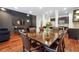 Open-concept dining room with a large wooden table, seating for eight, and kitchen views at 1802 Dekalb Ne Ave, Atlanta, GA 30307