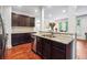 Gourmet kitchen with stainless steel appliances, granite countertops, and dark wood cabinets at 1802 Dekalb Ne Ave, Atlanta, GA 30307