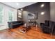 Cozy living room with hardwood floors, comfortable seating, a modern TV, and stylish decor at 1802 Dekalb Ne Ave, Atlanta, GA 30307