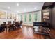 Spacious living and dining area with hardwood floors, large windows, and stylish, comfortable seating at 1802 Dekalb Ne Ave, Atlanta, GA 30307