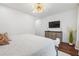 Serene primary bedroom with elegant decor, white walls, and hardwood floors at 1802 Dekalb Ne Ave, Atlanta, GA 30307