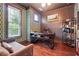 Stylish office with colorful wallpaper, a modern desk, hardwood floors, and natural light from the window at 1802 Dekalb Ne Ave, Atlanta, GA 30307