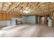 Unfinished basement with exposed ceiling and concrete floors at 2735 Maple Park Pl # 32, Cumming, GA 30041