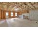Unfinished basement with a walkout door, windows and exposed ceiling at 2735 Maple Park Pl # 32, Cumming, GA 30041