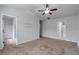 Spacious bedroom with a ceiling fan, closet, and ensuite bathroom at 2735 Maple Park Pl # 32, Cumming, GA 30041