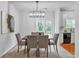 Cozy dining area with modern lighting and easy access to outdoor patio at 2735 Maple Park Pl # 32, Cumming, GA 30041