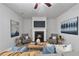 A living room featuring a fireplace, stylish decor, and comfortable seating arrangement at 2735 Maple Park Pl # 32, Cumming, GA 30041